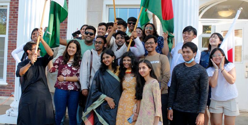 International students from many countries gather together for a group photo on the steps of Chapin Hall.