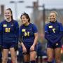 Lorraine Pedroza’24 (center) is introduced before the game against Washington University in St. Louis.